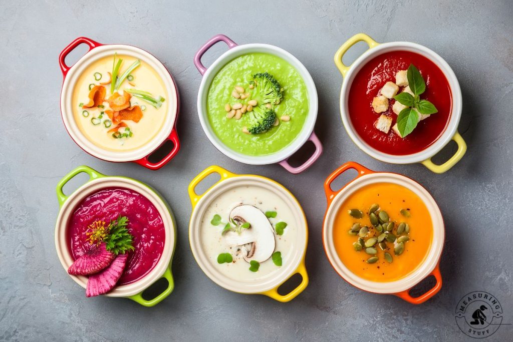 various bowls of colorful soup