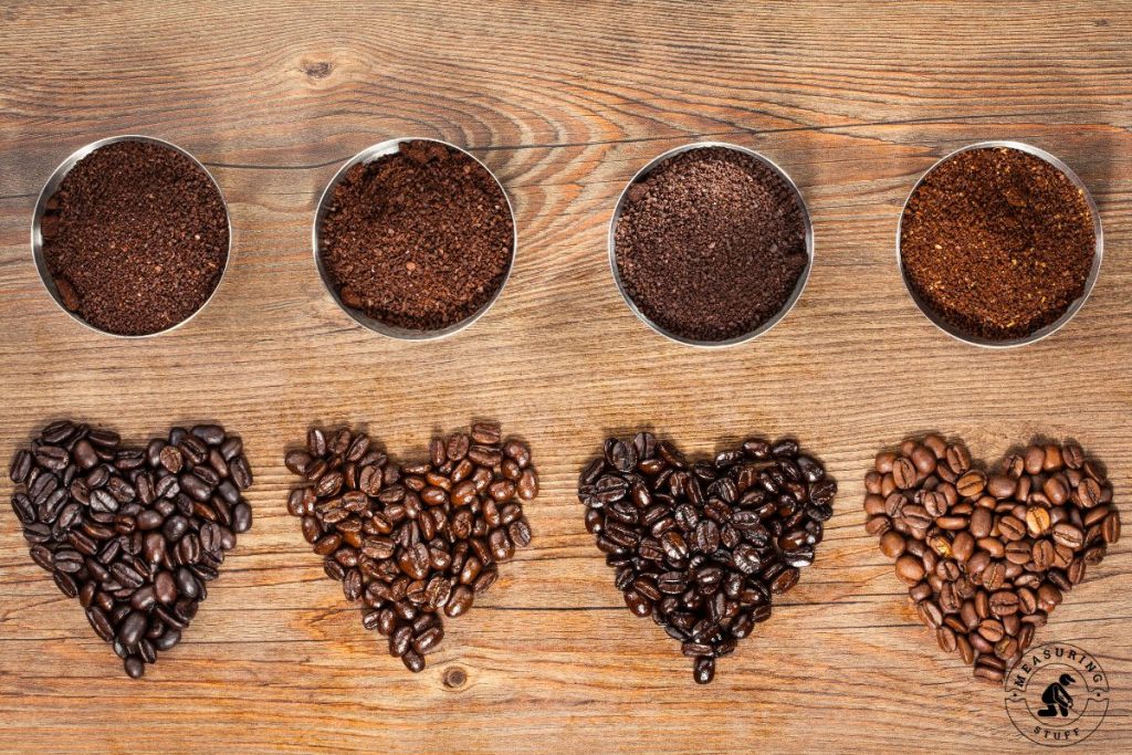 various types of coffee beans on wood table