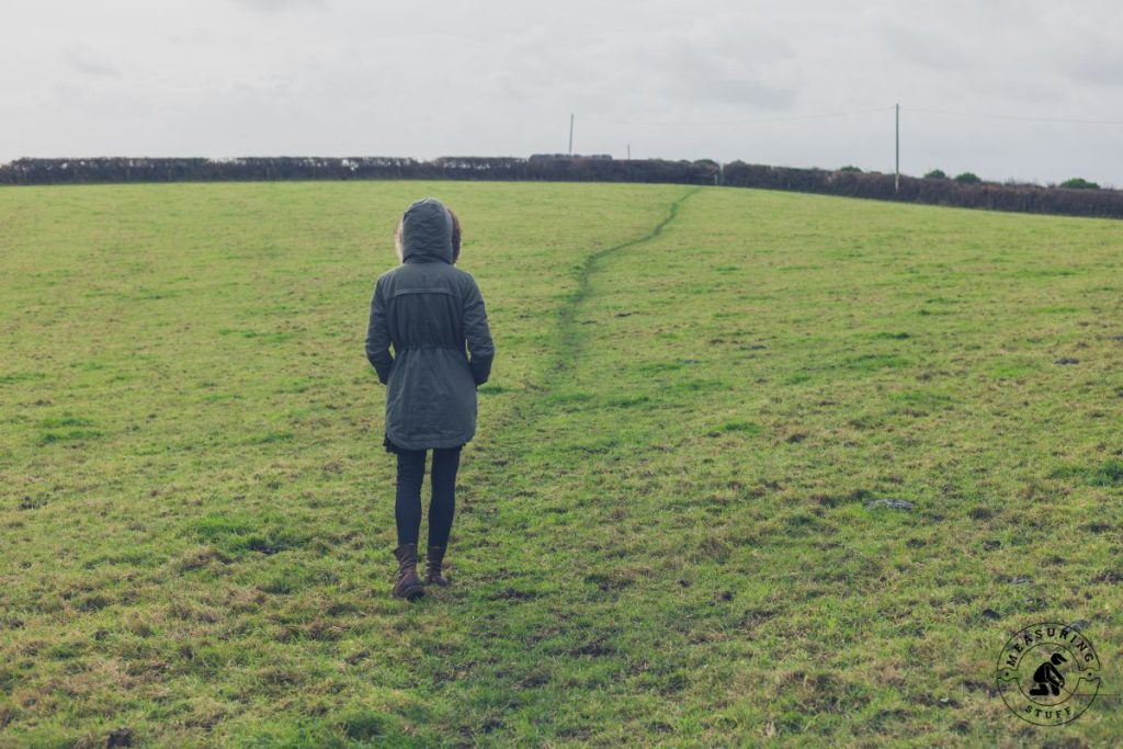 woman walking in a large open field