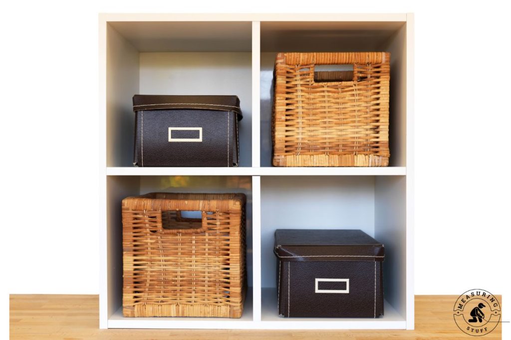 small shelf with wicker and leather storage cubes 