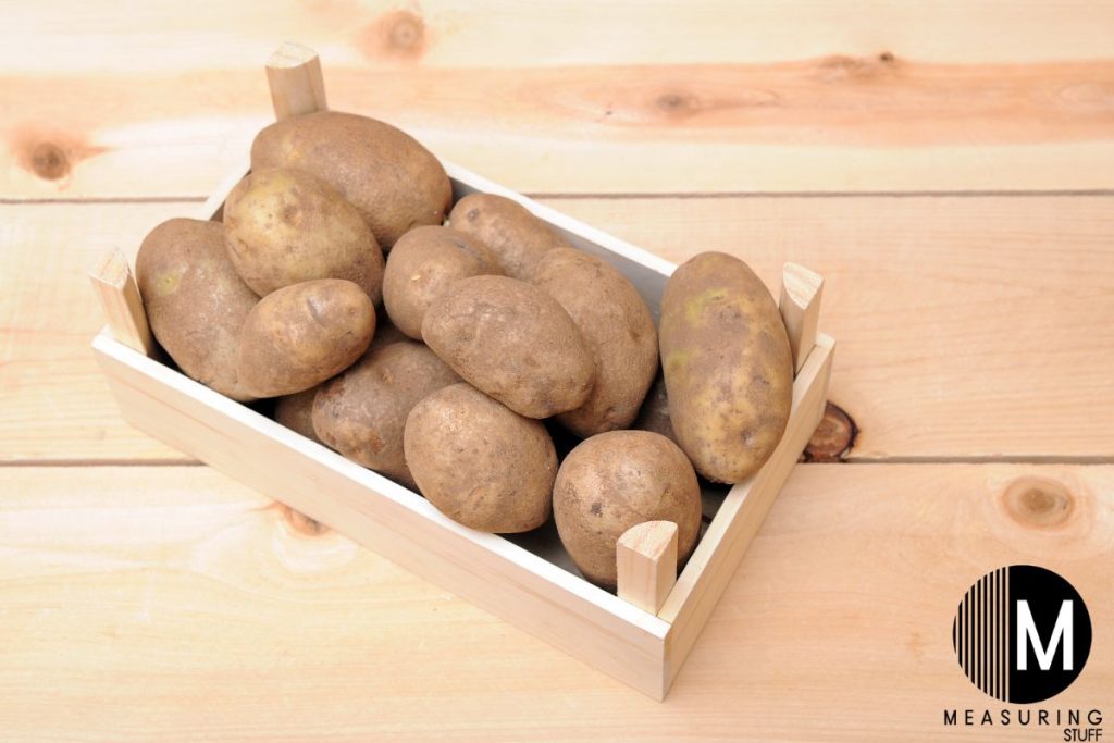 wooden basket of russet potatoes