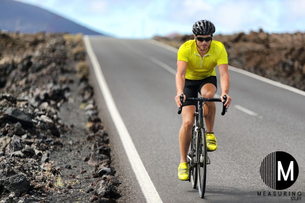 man riding a racing bike
