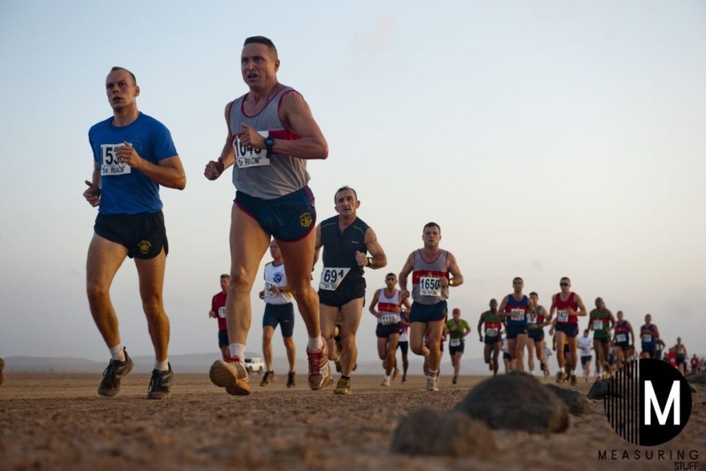 marathon runners training on dirt road