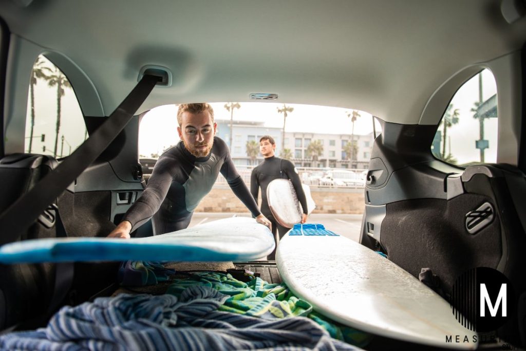 loading surfboards into a car