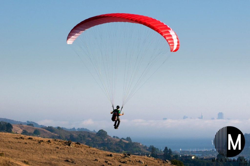 paraglider over a hill