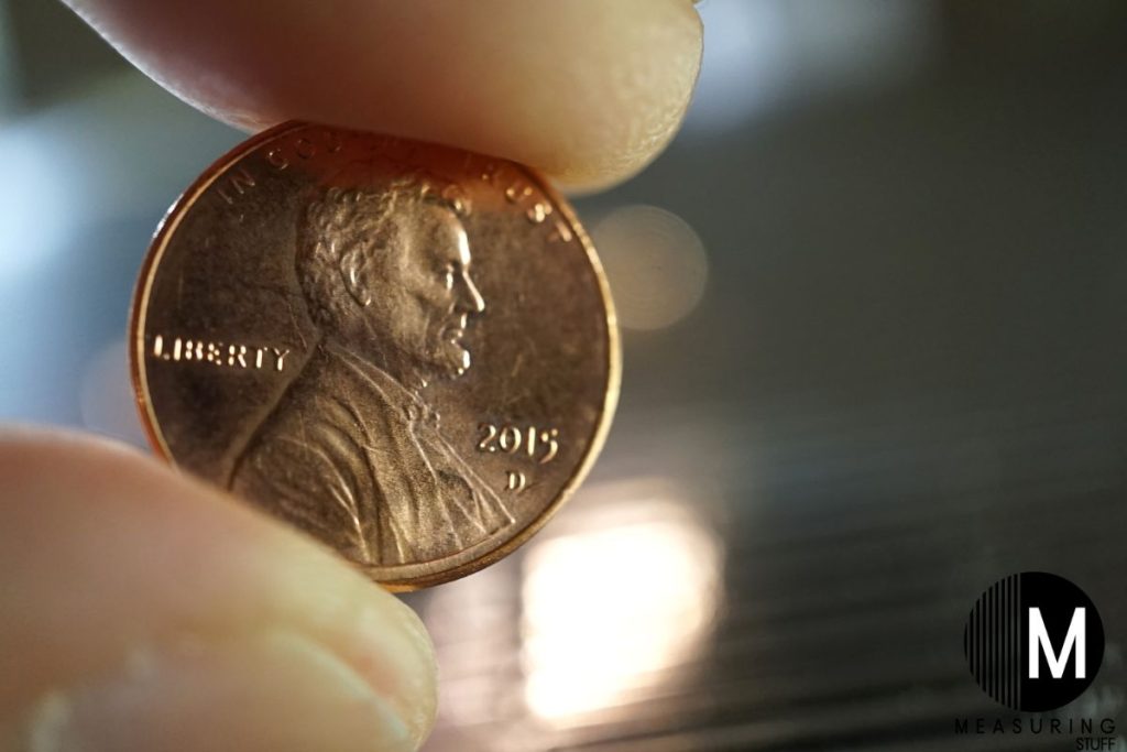 holding a penny coin