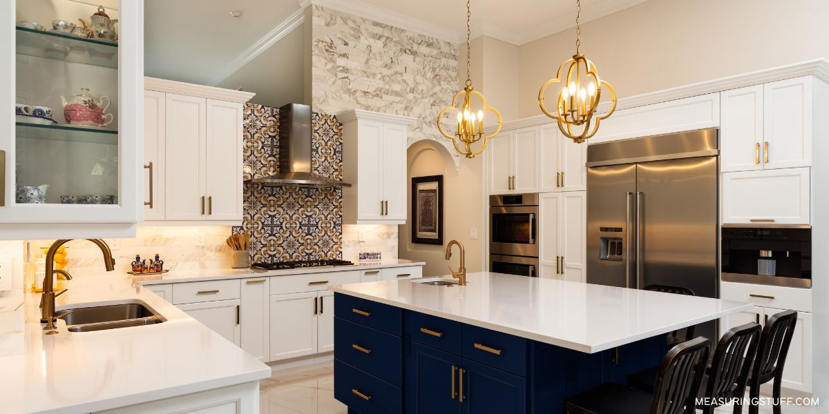 large kitchen with island under lights