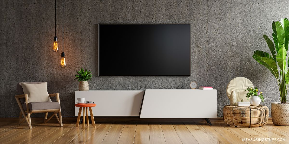 wall mounted tv above a ssofa