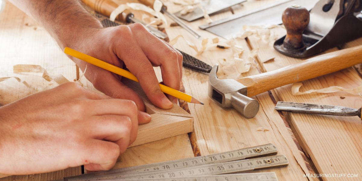 carpenter measuring a wooden right angle