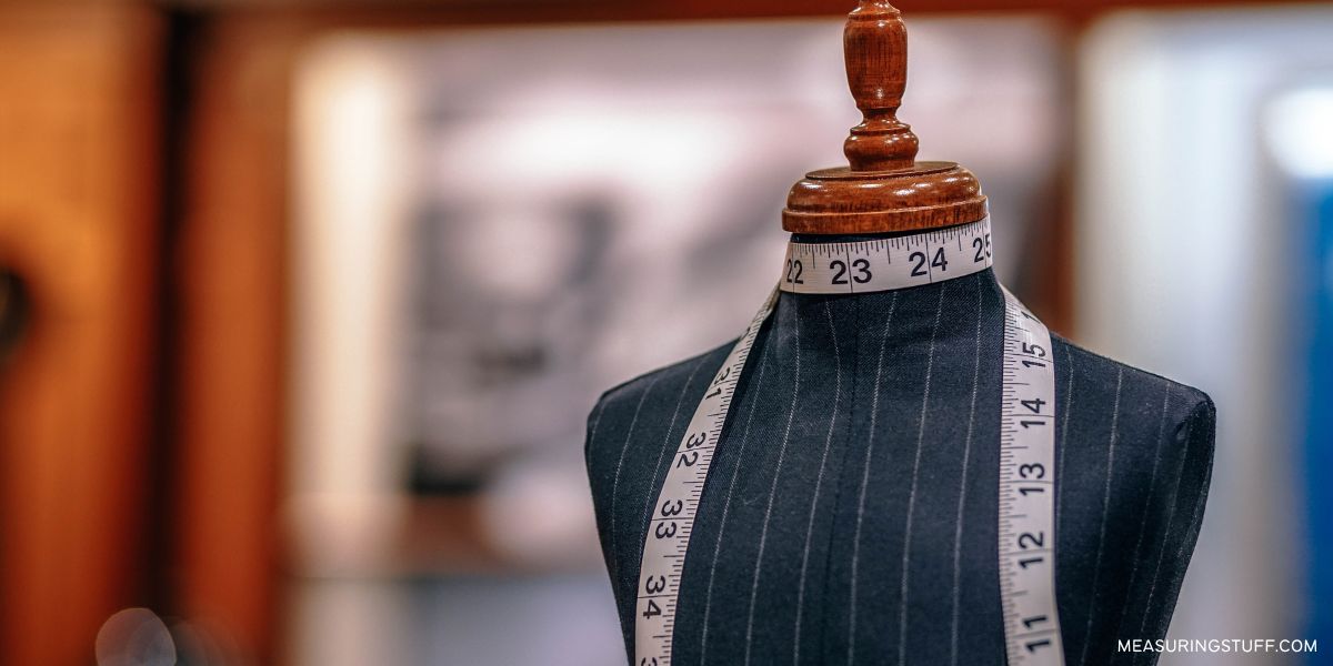 sewing measuring tape on a manequin