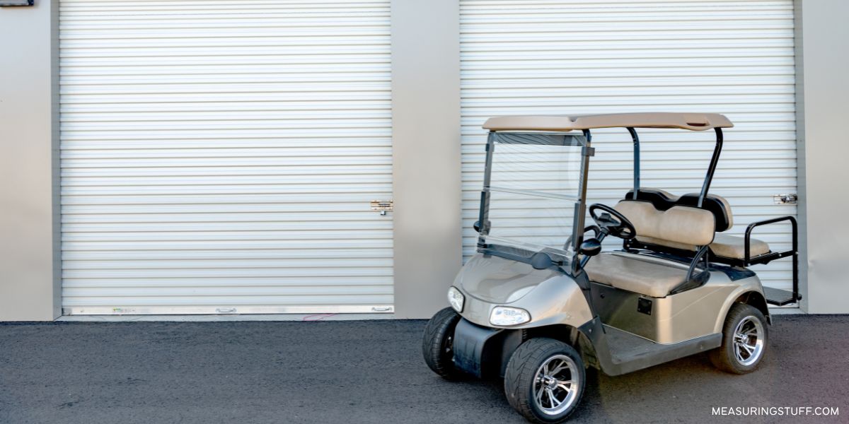 golf cart next to a storage unit