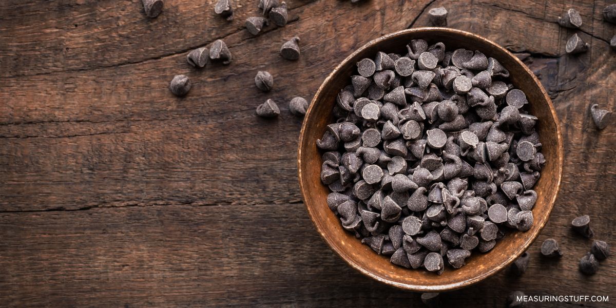 dish of chocolate chips on a wood table