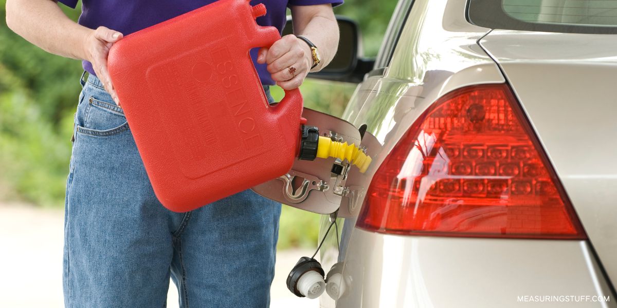 pouring gas into a car with a gas can