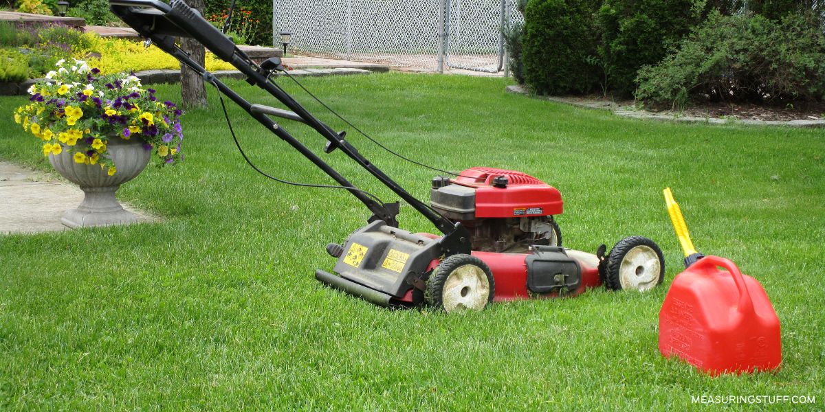 lawn mower on lawn with a jerry can