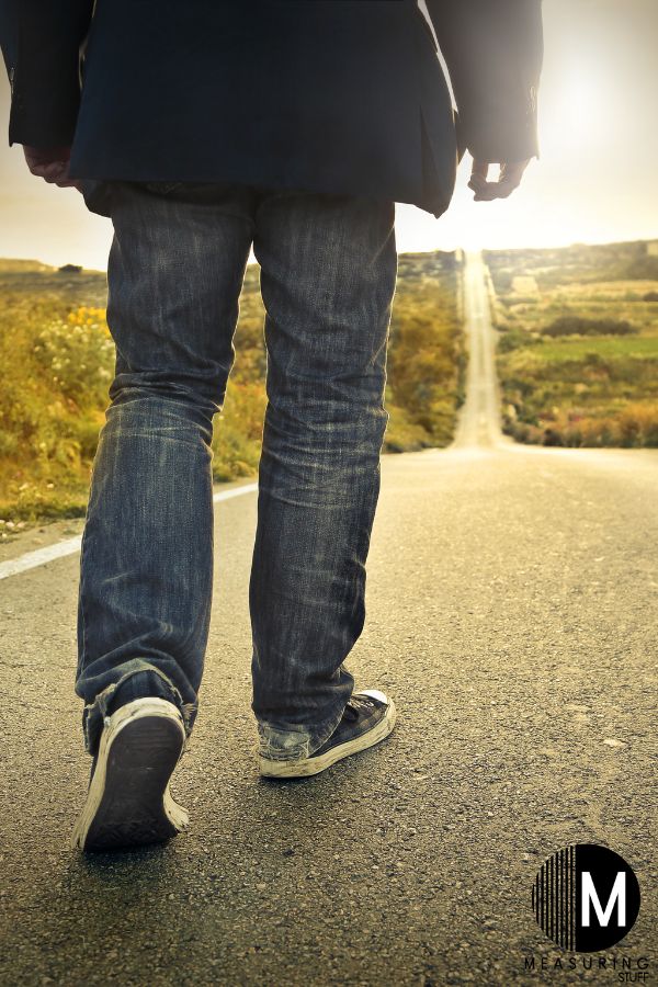 man walking on highway