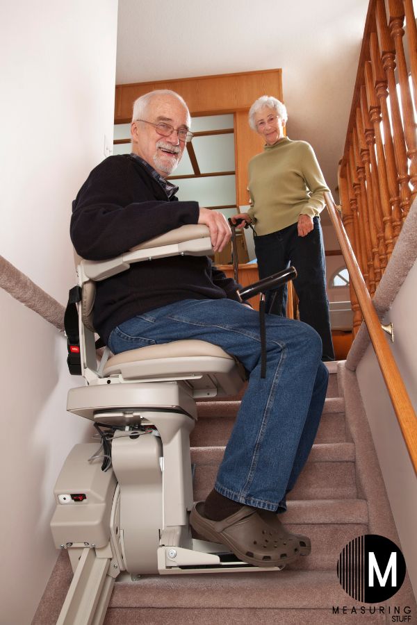 senior man riding on a stairlift