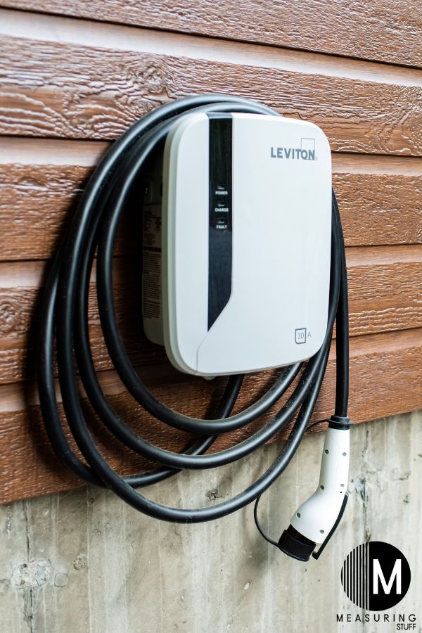 electric car charging cable attached to a wall