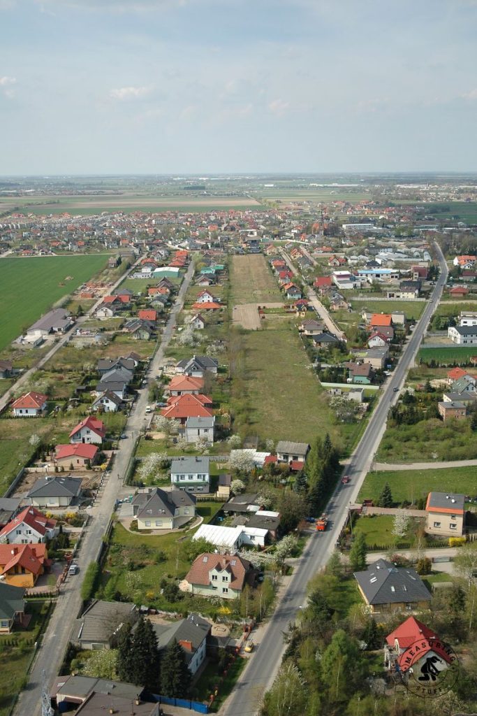 overhead view of roads and houses in a town