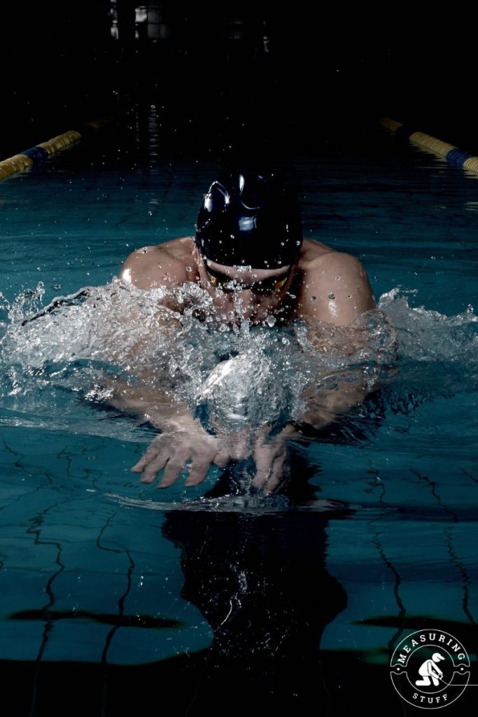 closeup of man swimming in a pool