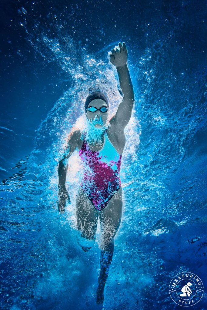 underwater view of woman swimming in a pool