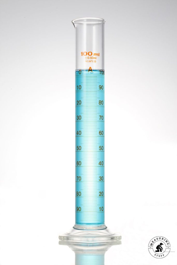 measuring cylinder with 100 ml of liquid