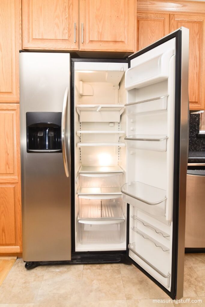 27 cubic foot refrigerator with one open door