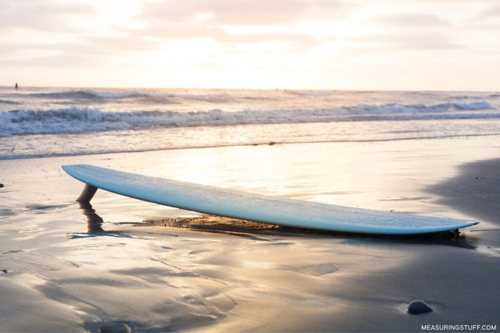 surfboard laying on the beach