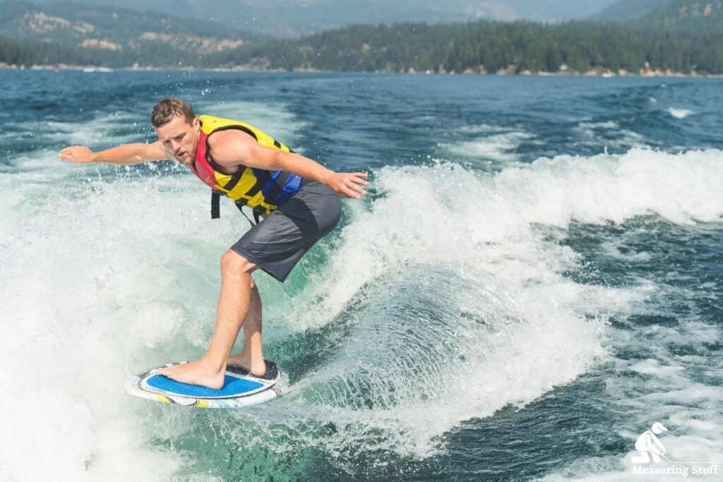 man riding a wakesurf board