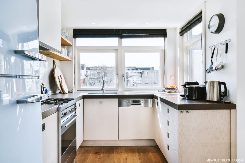small apartment kitchen with windows