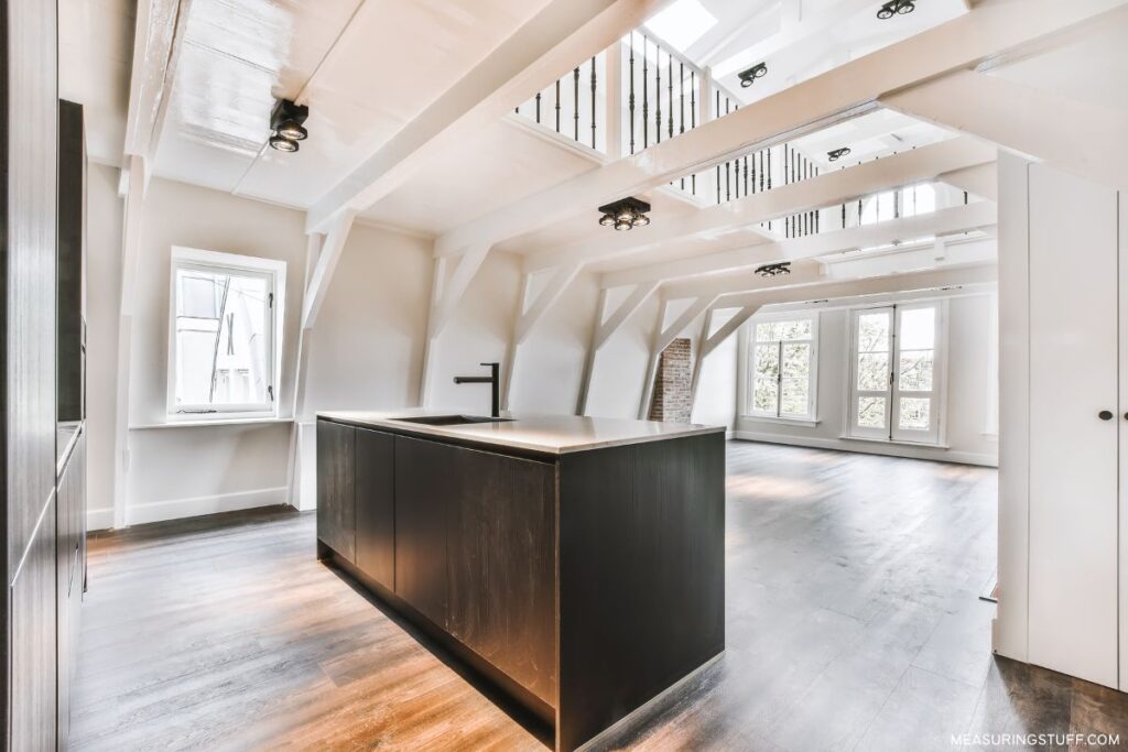 new kitchen island in a large unfurnished area
