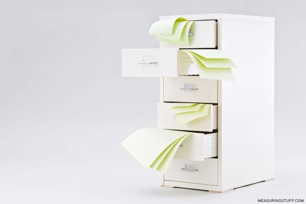 filing cabinet with open drawers and papers