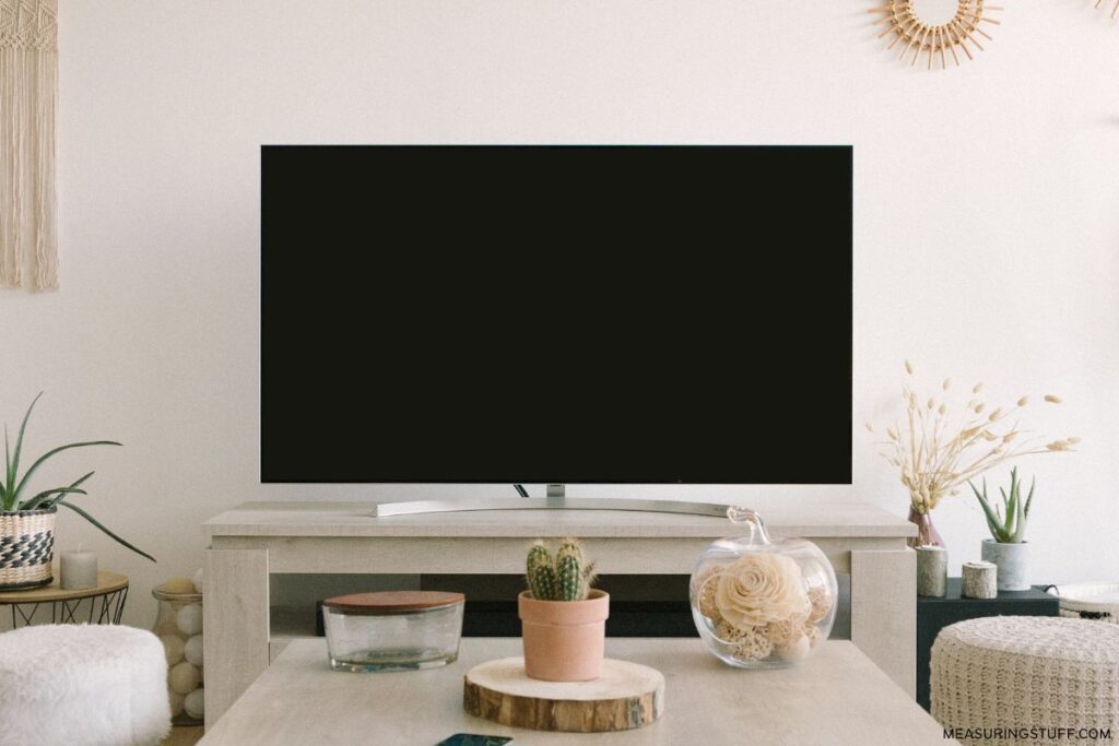 flat screen tv and stand on an electric fireplace