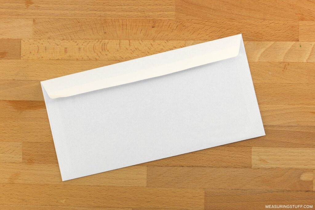 business envelope on wood table