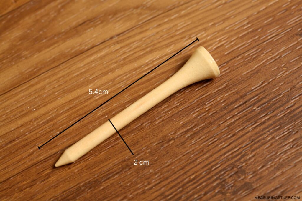 golf tee on a desk with 2cm marking