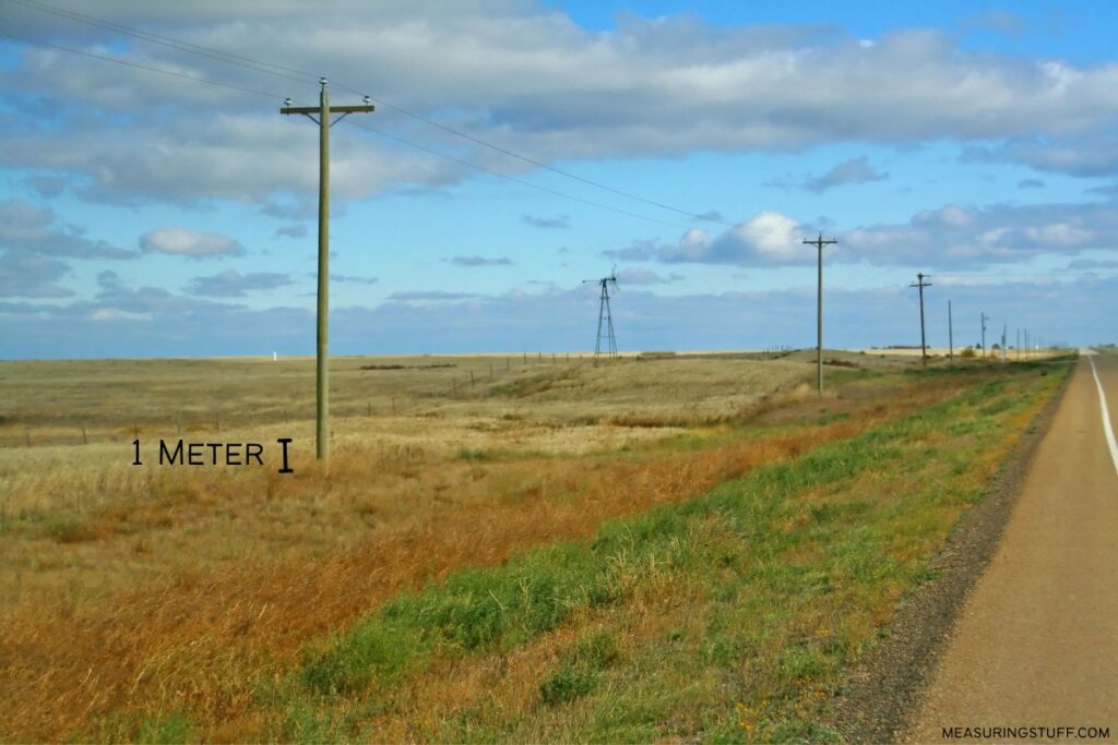 telephone pole used as a reference to how big 1 meter is