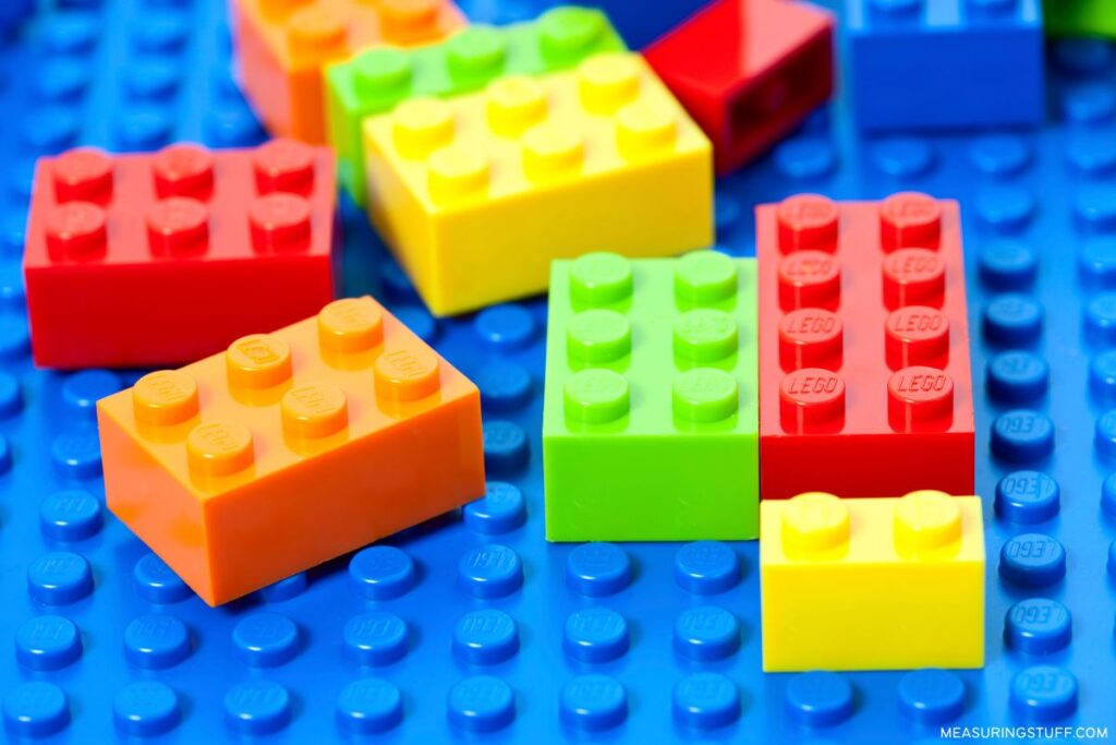 multi colored lego bricks used to reference how much half a gram weighs