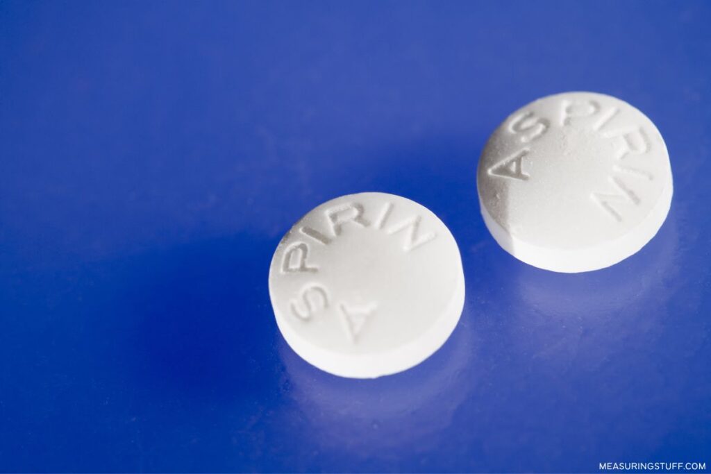 pair of aspirin tablets used to reference how much half a gram weighs