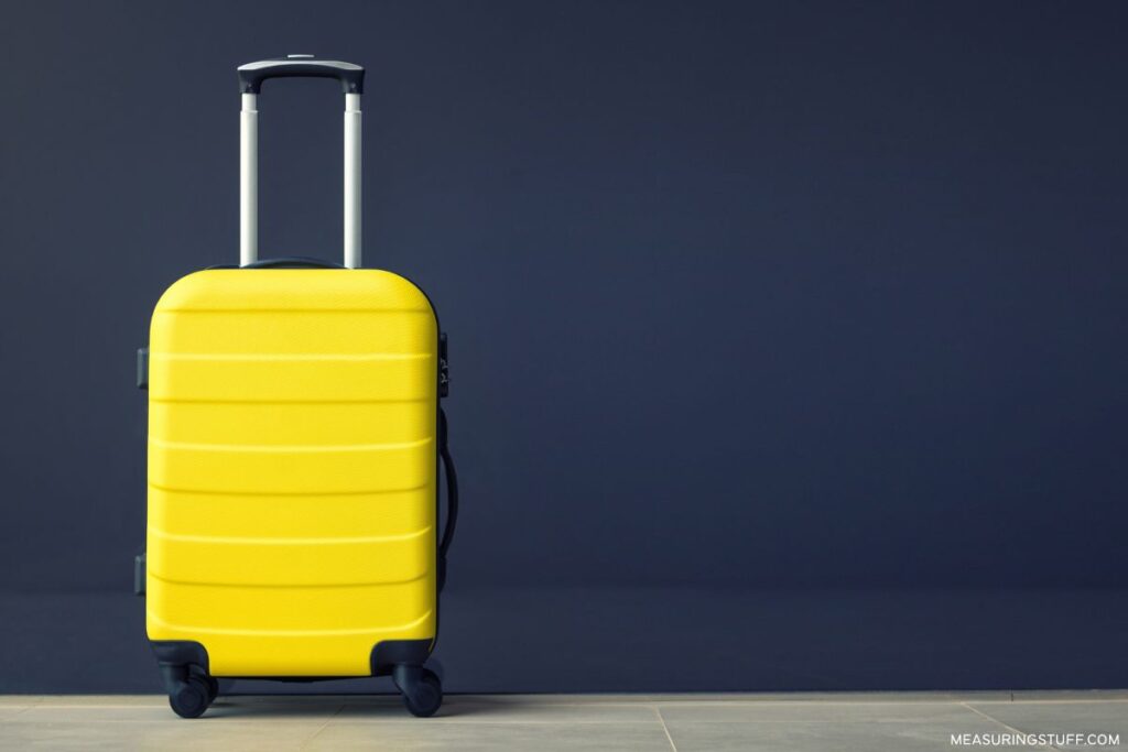 yellow hardshell luggage bag