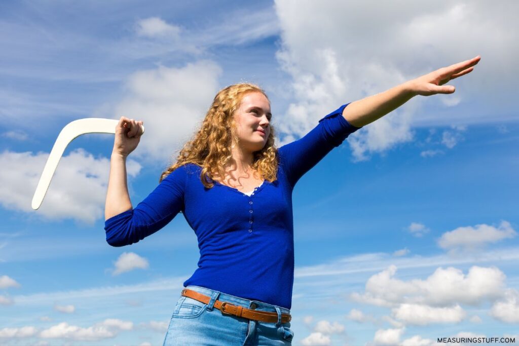 woman aiming to throw a boomerang