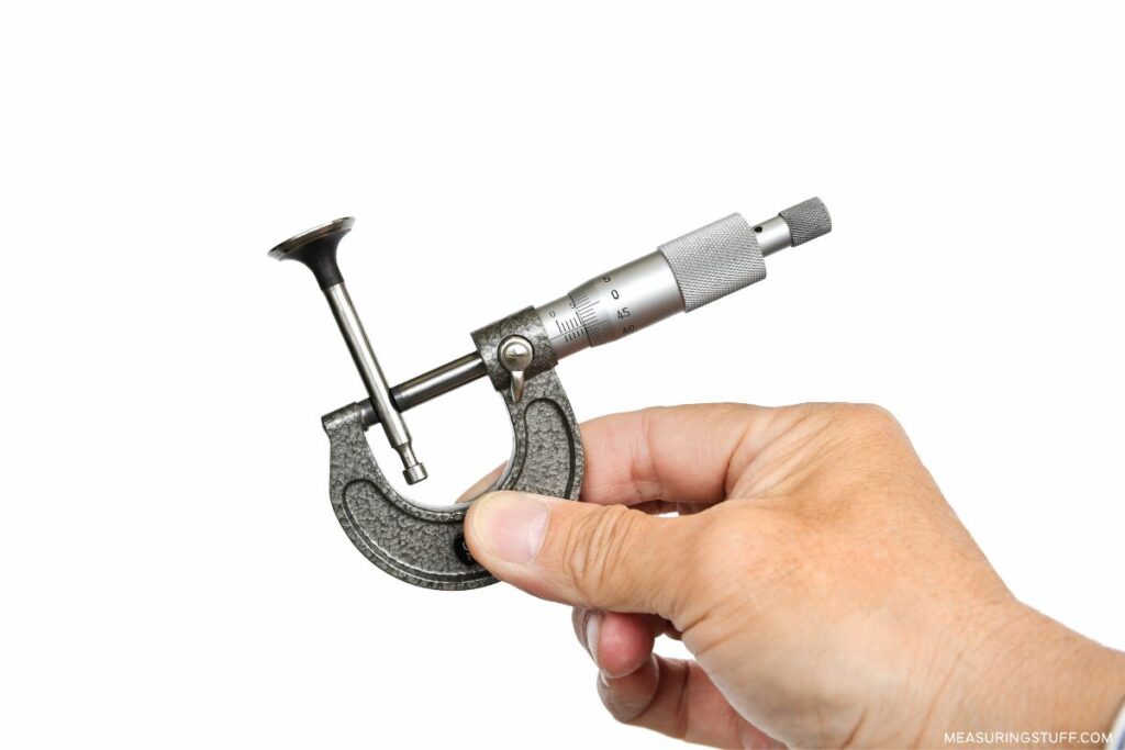 holding a micrometer