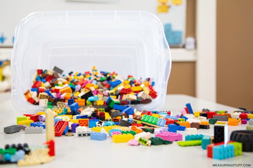 plastic container tipped over with Lego pieces