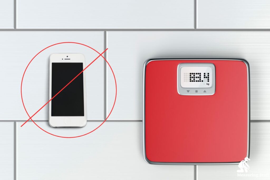 cell phone next to a digital scale