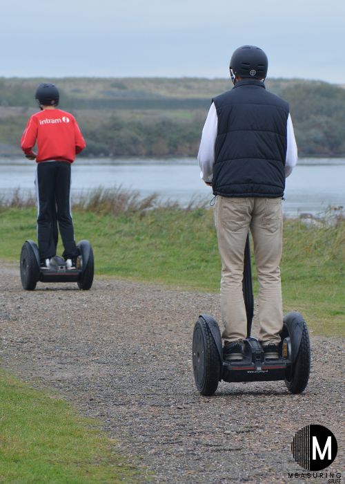 segway riders on a path