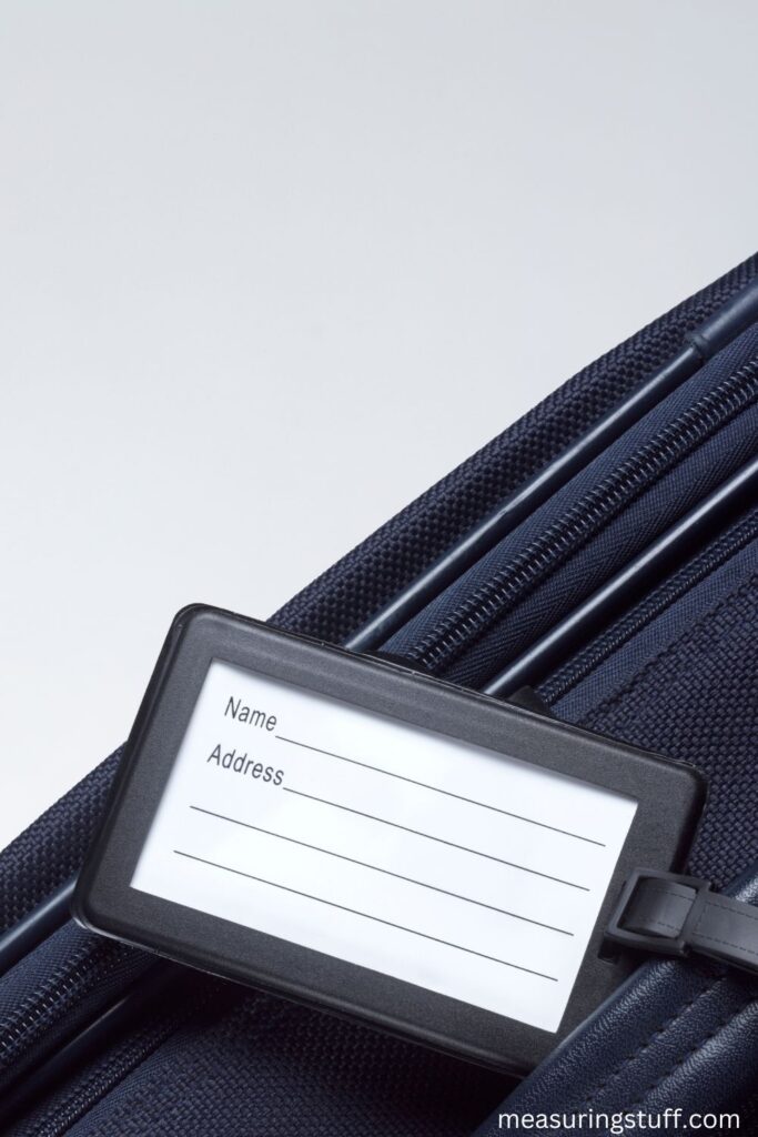 white color luggage tag with empty name and address
